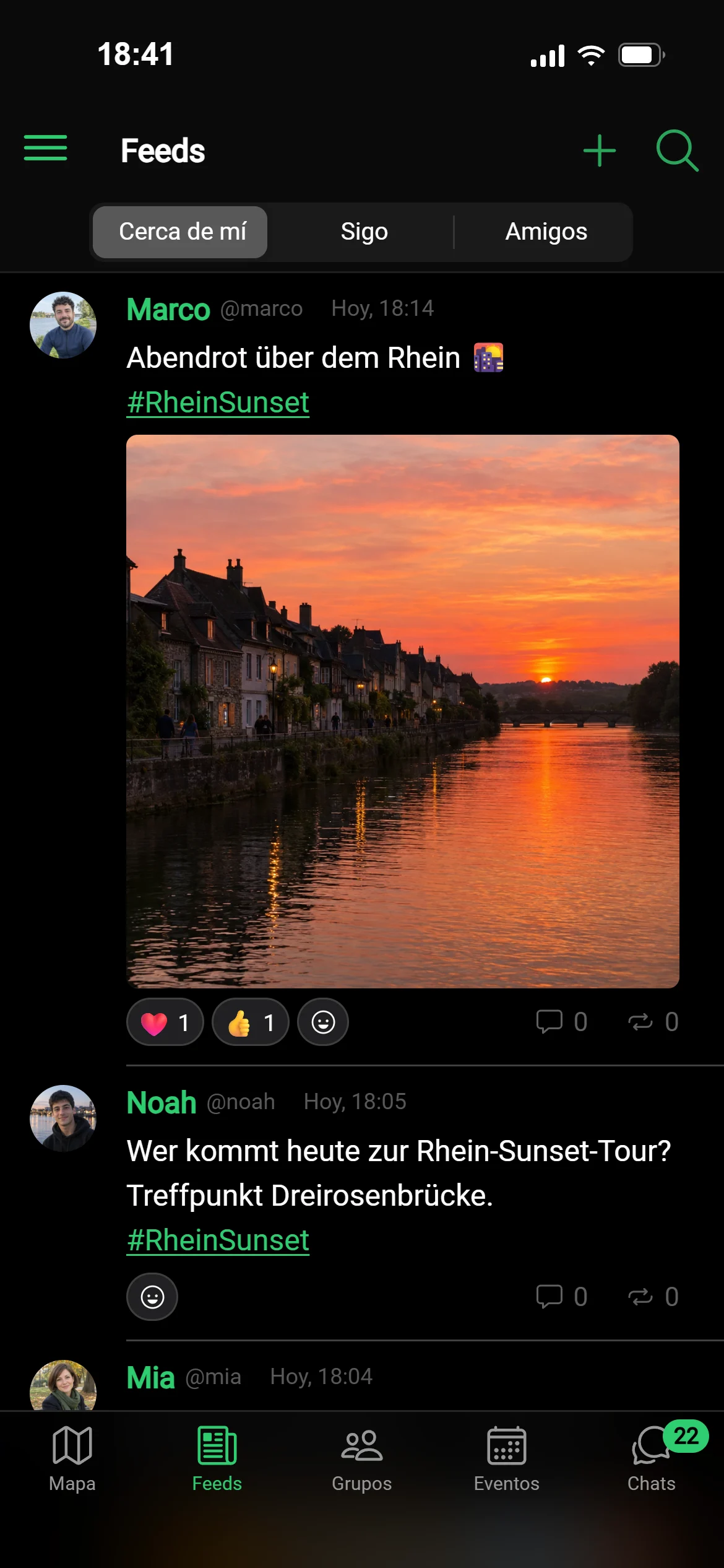 El feed «Cerca de mí» en GeoQuestly: publicaciones de los alrededores, las más recientes primero, una foto del atardecer sobre el Rin con reacciones
